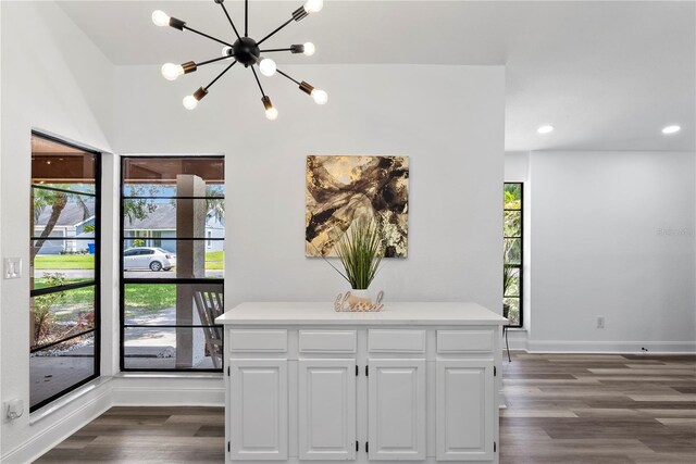 4715 Kemble Ct, Tampa, FL 33624 - interior space featuring dark wood-type flooring, baseboards, a chandelier, and recessed lighting