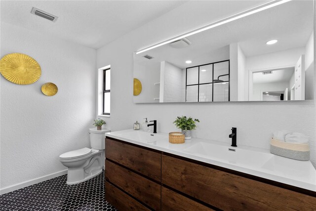 4715 Kemble Ct, Tampa, FL 33624 - bathroom with visible vents, a sink, toilet, and double vanity