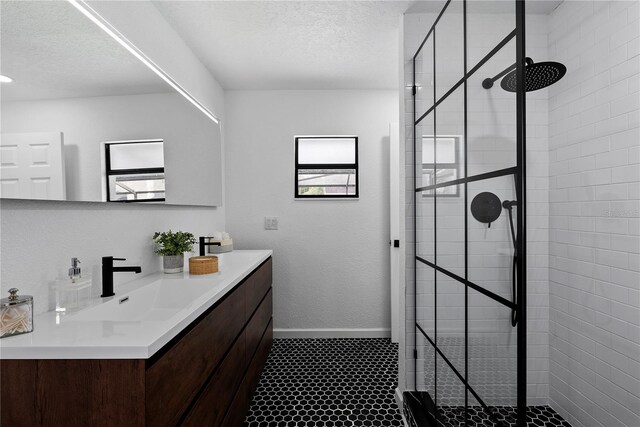 4715 Kemble Ct, Tampa, FL 33624 - full bathroom with baseboards, a textured ceiling, a stall shower, and vanity