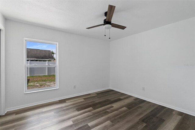 4715 Kemble Ct, Tampa, FL 33624 - empty room with baseboards, wood finished floors, and a ceiling fan