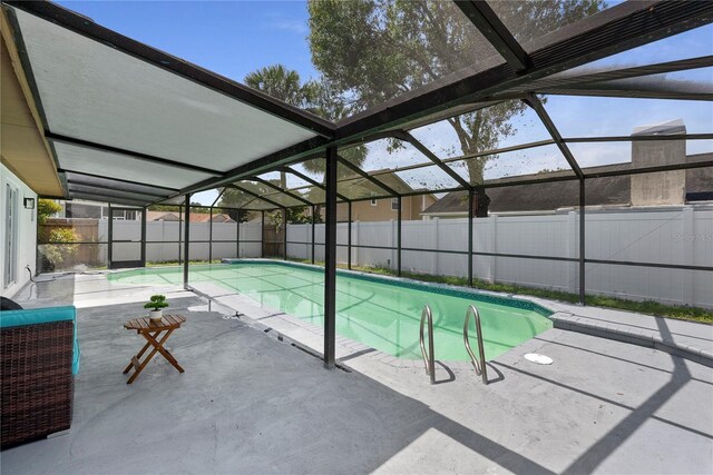 4715 Kemble Ct, Tampa, FL 33624 - view of pool featuring a fenced backyard, a fenced in pool, glass enclosure, and a patio area