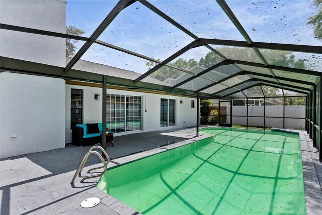 4715 Kemble Ct, Tampa, FL 33624 - view of pool with glass enclosure, fence, and a patio