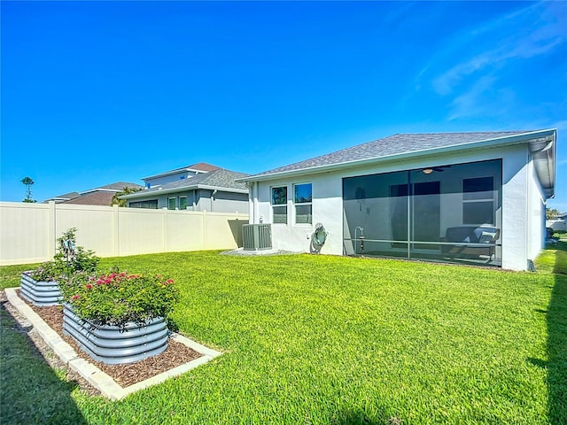5415 Los Robles Ct, Palmetto, FL 34221 - back of house featuring a sunroom, stucco siding, and a shingled roof