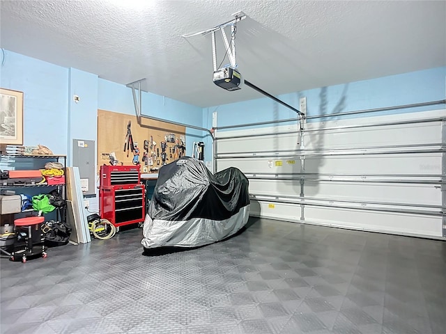 5415 Los Robles Ct, Palmetto, FL 34221 - garage featuring a garage door opener and electric panel