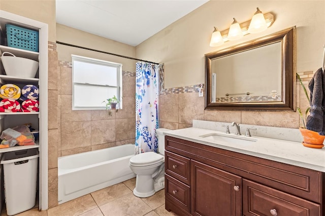 13979 Barbados Dr, Seminole, FL 33776 - full bath featuring tile patterned flooring, tile walls, shower / bathtub combination with curtain, toilet, and vanity