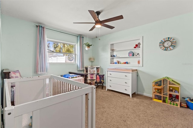 13979 Barbados Dr, Seminole, FL 33776 - bedroom featuring a ceiling fan, a nursery area, and carpet floors