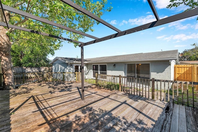 wooden terrace with a pergola and fence