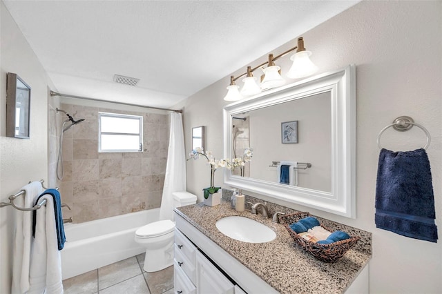 full bath featuring visible vents, vanity, tile patterned floors, toilet, and shower / bath combo with shower curtain