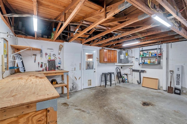 interior space with a workshop area and water heater