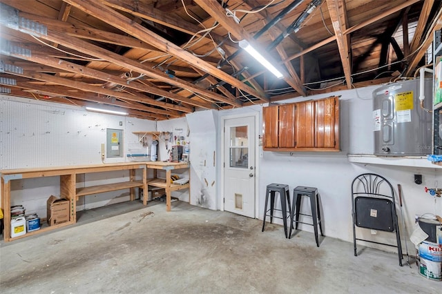 unfinished basement with electric panel and a workshop area