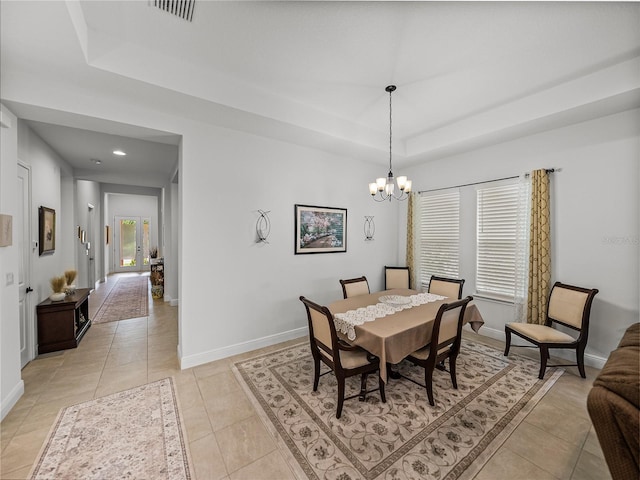 dining space featuring light tile patterned floors, baseboards, a raised ceiling, visible vents, and a notable chandelier