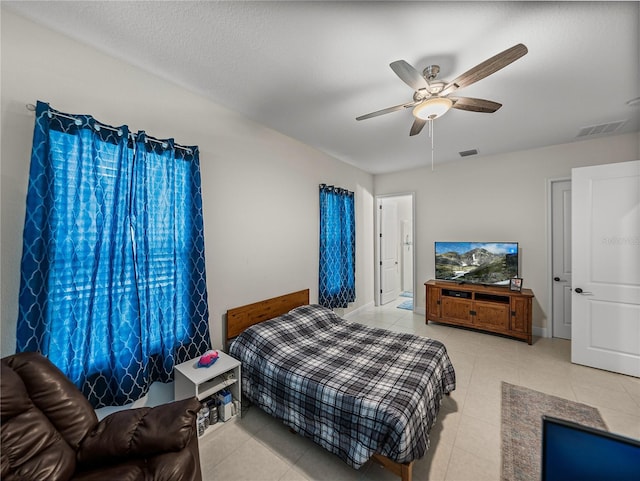 tiled bedroom with baseboards, ceiling fan, and visible vents