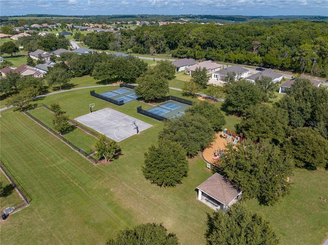 bird's eye view featuring a view of trees and a residential view