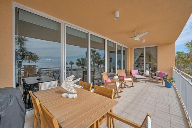 view of patio / terrace with grilling area, ceiling fan, outdoor dining space, and a balcony