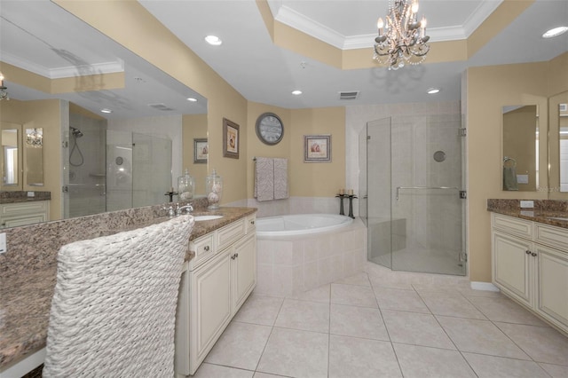 full bath featuring a tray ceiling, a shower stall, visible vents, and an inviting chandelier