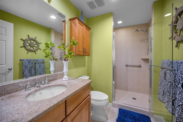 bathroom featuring a stall shower, tile patterned floors, recessed lighting, and toilet