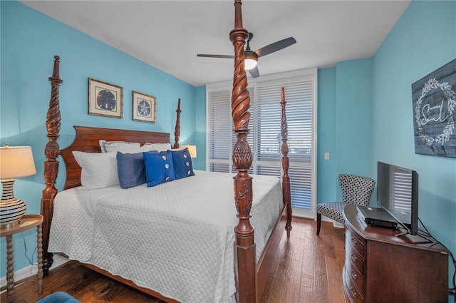 bedroom featuring baseboards, hardwood / wood-style flooring, and ceiling fan