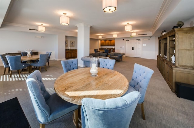 dining space with light colored carpet, baseboards, ornamental molding, and visible vents