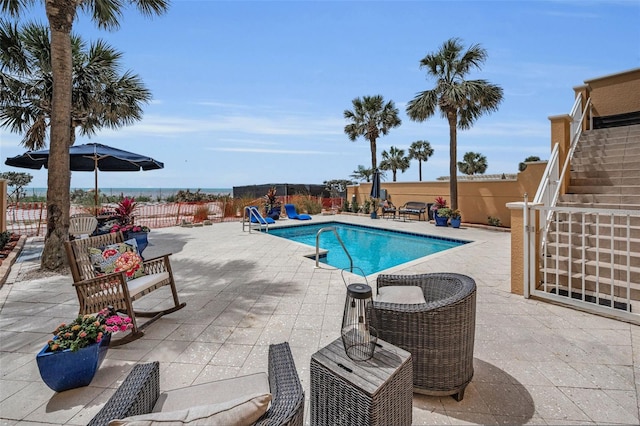 view of pool with a fenced backyard, a patio area, and a fenced in pool