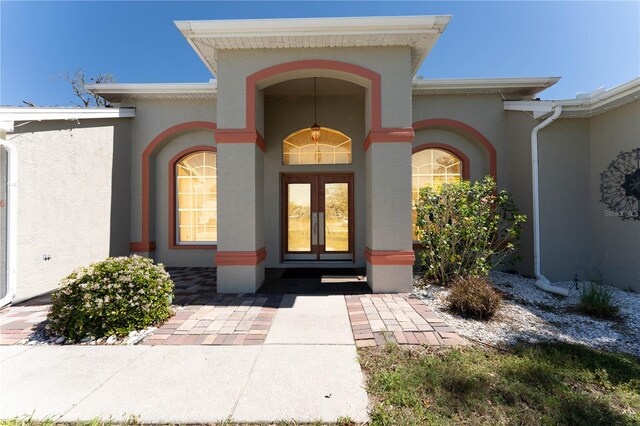 property entrance with stucco siding