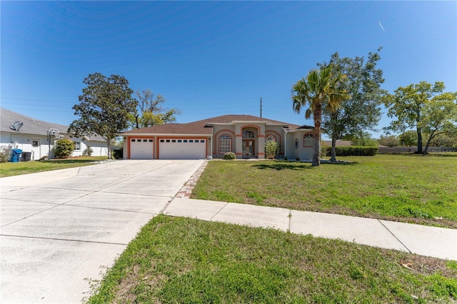 mediterranean / spanish-style house with a front lawn, driveway, stucco siding, and a garage