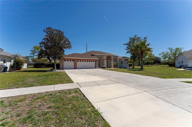 view of front of home with concrete driveway, a front lawn, and an attached garage