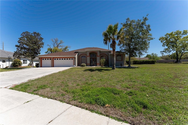 view of front of house featuring a front lawn, stucco siding, an attached garage, and concrete driveway