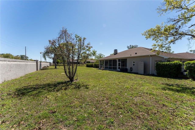 view of yard featuring a sunroom