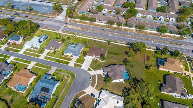 birds eye view of property with a residential view