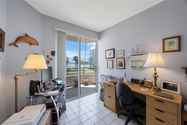 8020 Sailboat Key Blvd S Unit 101, St Pete Beach, FL 33707 - home office featuring light tile patterned flooring and a textured ceiling