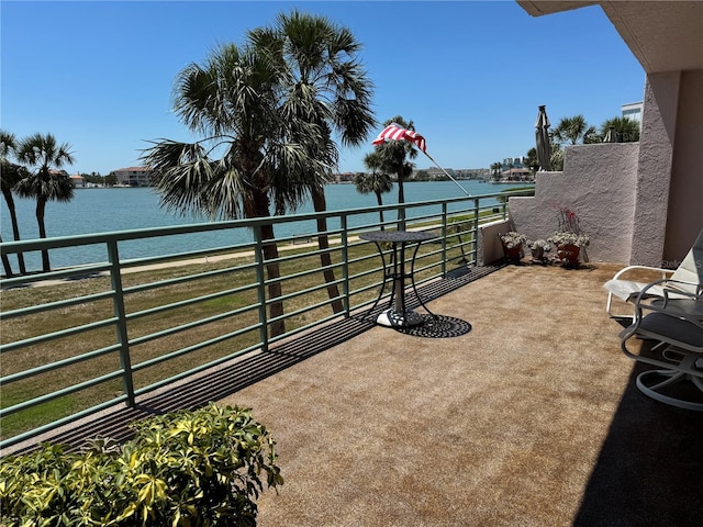 8020 Sailboat Key Blvd S Unit 101, St Pete Beach, FL 33707 - view of patio / terrace featuring a balcony and a water view