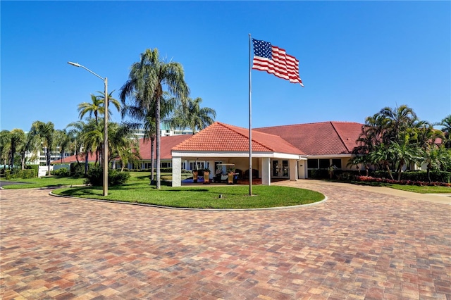 8020 Sailboat Key Blvd S Unit 101, St Pete Beach, FL 33707 - view of building exterior with curved driveway