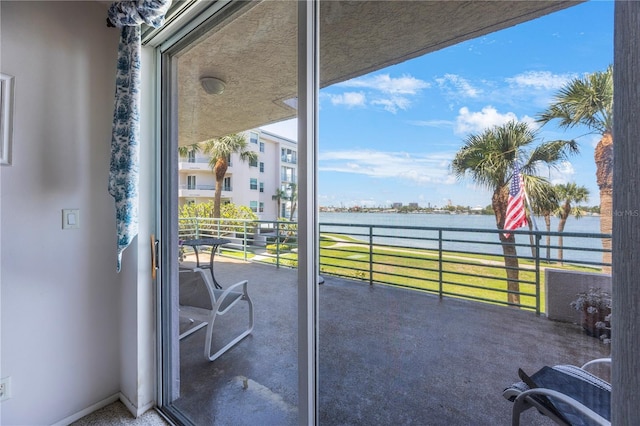 8020 Sailboat Key Blvd S Unit 101, St Pete Beach, FL 33707 - view of patio / terrace with a water view and a balcony