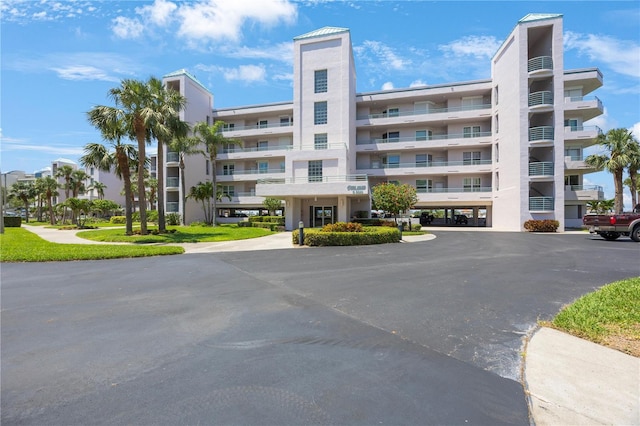 8020 Sailboat Key Blvd S Unit 101, St Pete Beach, FL 33707 - view of apartment building / complex with uncovered parking