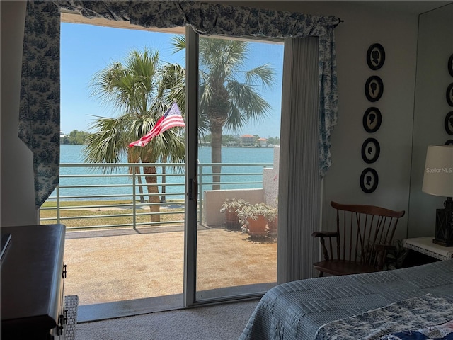 8020 Sailboat Key Blvd S Unit 101, St Pete Beach, FL 33707 - carpeted bedroom with a water view and access to outside