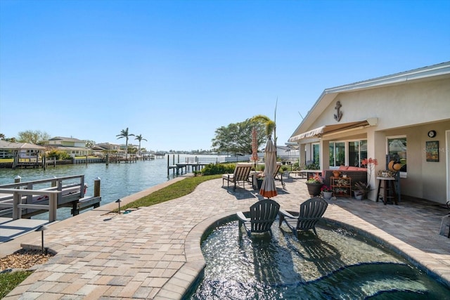 4544 Harbor Hills Dr, Largo, FL 33770 - view of patio with a dock and a water view