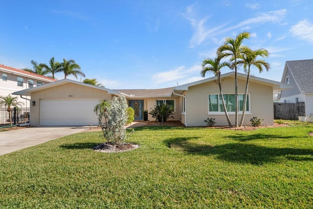 4544 Harbor Hills Dr, Largo, FL 33770 - single story home featuring a garage, concrete driveway, stucco siding, and fence