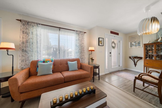 4544 Harbor Hills Dr, Largo, FL 33770 - living room featuring baseboards and wood finished floors
