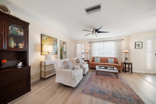 4544 Harbor Hills Dr, Largo, FL 33770 - living area with baseboards, visible vents, light wood-style floors, and ceiling fan