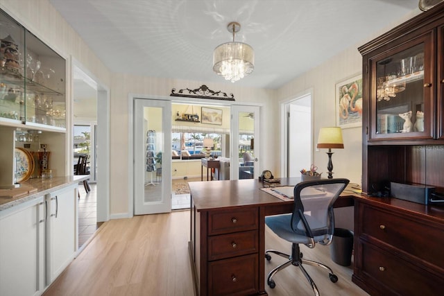 4544 Harbor Hills Dr, Largo, FL 33770 - home office featuring light wood-type flooring and a notable chandelier