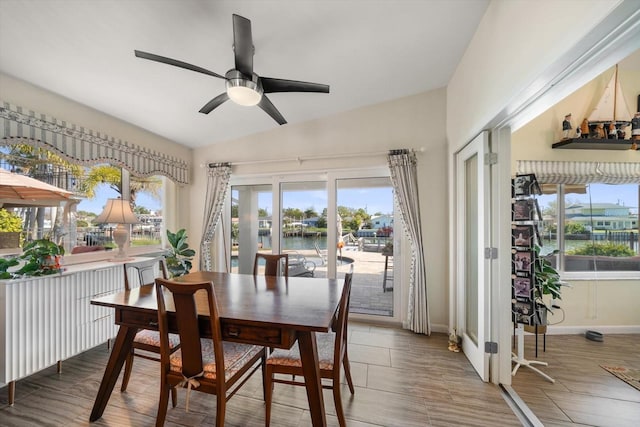 4544 Harbor Hills Dr, Largo, FL 33770 - dining room featuring baseboards, lofted ceiling, and ceiling fan
