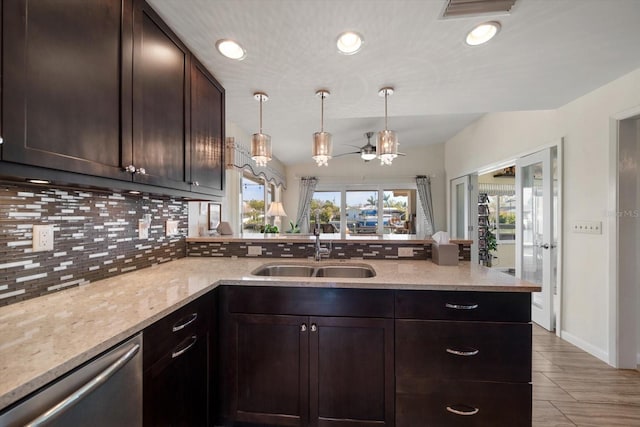 4544 Harbor Hills Dr, Largo, FL 33770 - kitchen with backsplash, a sink, visible vents, dishwasher, and a peninsula