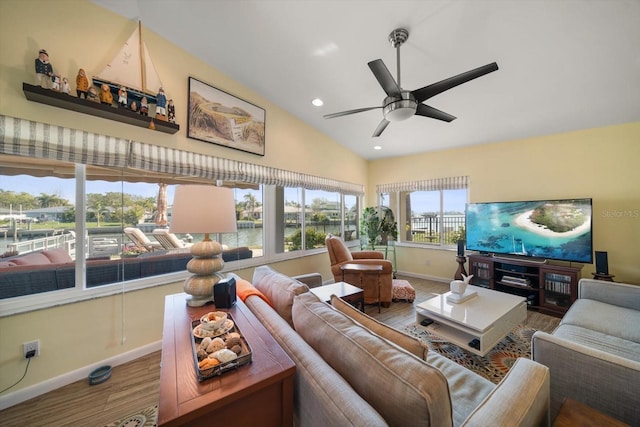 4544 Harbor Hills Dr, Largo, FL 33770 - living area with vaulted ceiling, wood finished floors, baseboards, ceiling fan, and recessed lighting