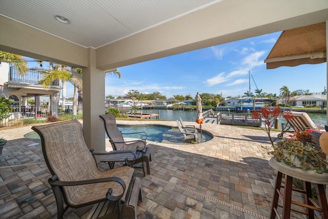 4544 Harbor Hills Dr, Largo, FL 33770 - view of patio with a water view, boat lift, and a dock