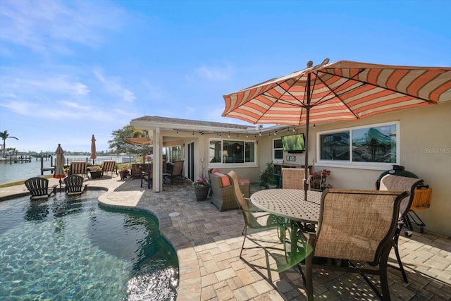 4544 Harbor Hills Dr, Largo, FL 33770 - view of patio / terrace with an outdoor pool, outdoor dining area, a water view, and fence