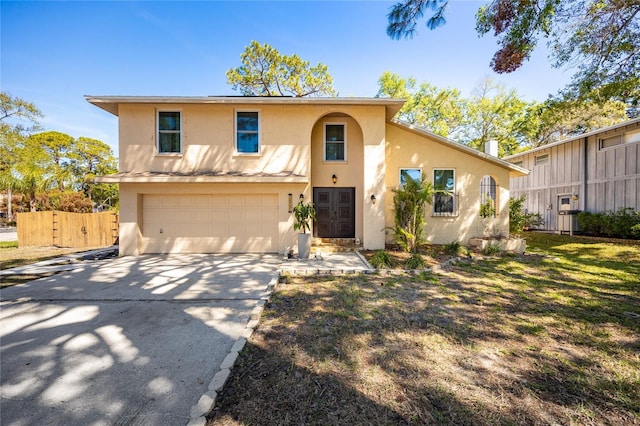 14323 83rd Pl, Seminole, FL 33776 - view of front of property featuring stucco siding, fence, driveway, and an attached garage