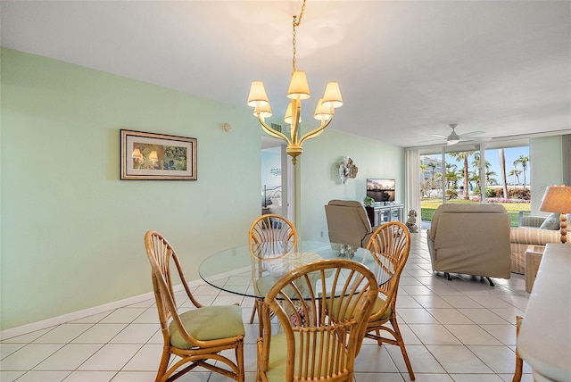 6021 Bahia Del Mar Cir Unit 137, Saint Petersburg, FL 33715 - dining area with ceiling fan with notable chandelier, a wall of windows, baseboards, and light tile patterned floors