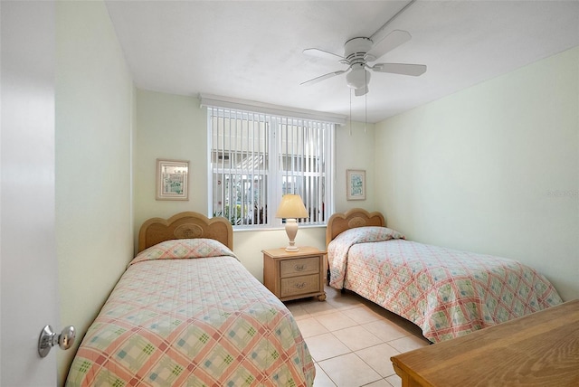 6021 Bahia Del Mar Cir Unit 137, Saint Petersburg, FL 33715 - bedroom with light tile patterned floors and ceiling fan