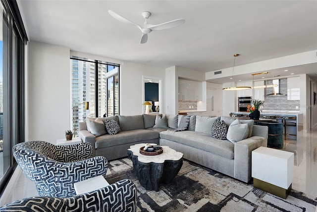 living area featuring ceiling fan