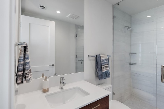 bathroom featuring visible vents, toilet, and a shower stall